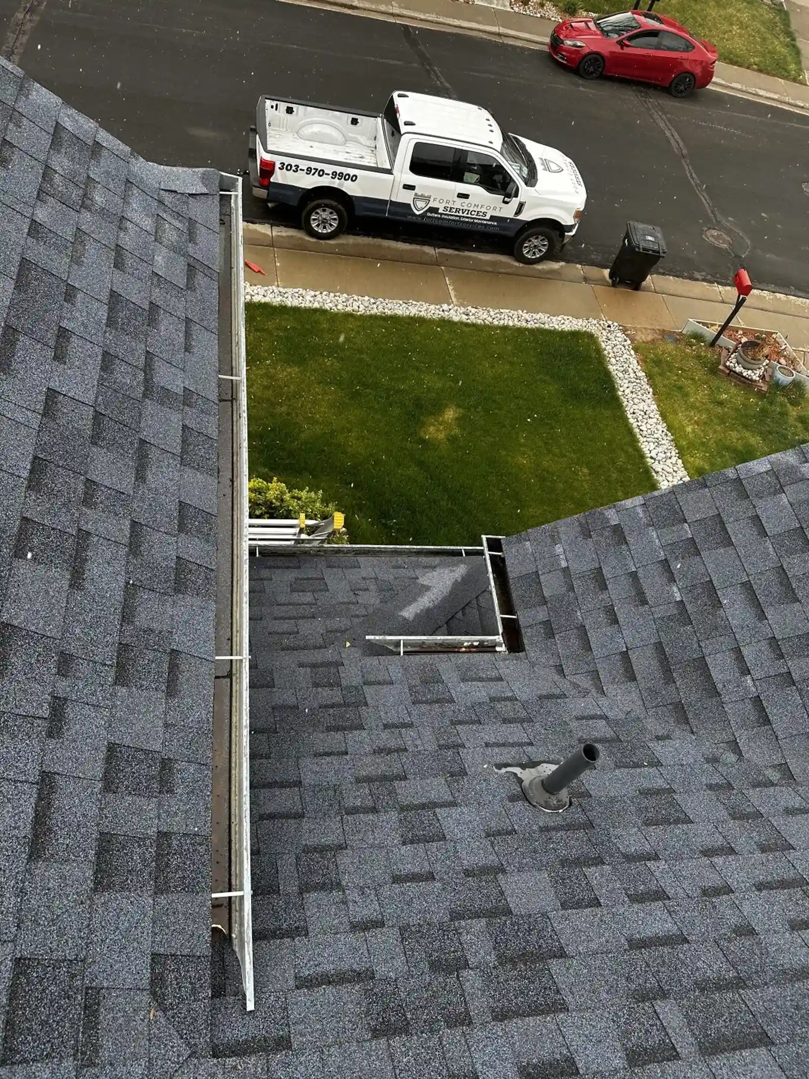 Fort Comfort Gutters truck on-site for a professional gutter cleaning